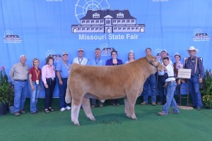 Photo Courtesy of Missouri State Fair: Stetson Wiss, 11, of Lamar, received Overall Champion in the 4-H Market Steer Show at the 2014 Missouri State Fair on August 12. Stetson is the son of Casey and Brooke Wiss and is a member of the Learn-A-Do 4-H Club. He is in the fifth grade at Lamar Elementary. Pictured with Stetson, left to right, is Fair Commissioner Lowell Mohler, Fair Commissioner Sherry Jones, Fair Commissioner Barbara Hayden, Fair Commissioner Ted Sheppard, Fair Commissioner Dr. Jack Magruder, Director MO Department of Agriculture Richard Fordyce, Judge Christy Gabel, 2014 Fair Queen Hanna Keene, Fair Director Mark Wolfe, Beef Superintendent David Dick, 2014 MO Beef Queen Julie Crouch and President MCA Jim McCain.