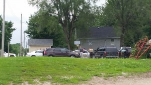 Members of the Carroll Co. Sheriff's office and the Missouri State Highway Patrol discuss strategy during a standoff in Tina, Mo. June 16th, 2015.