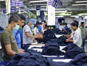 Employees work inside a garment factory of Orient Craft Ltd. at Gurgaon